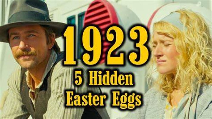 1923 includes several easter eggs and parallels to Yellowstone. Spencer Dutton points a rifle. He wears a beige hat and shirt.