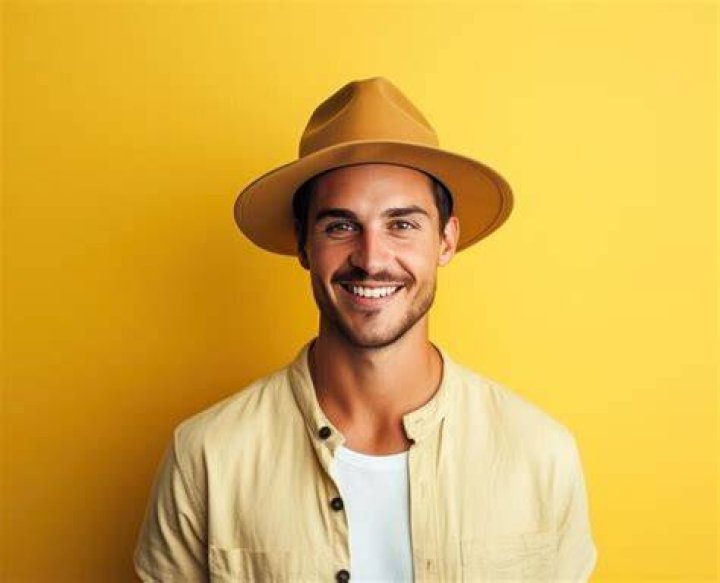 a person wearing a hat and a suit and tie a person wearing a hat and a suit and tie
