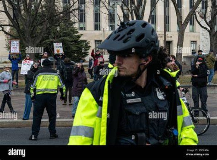 A police line separates people attending the "Freedom of Speech Rally Round II" from counter demonstrators outside the Islamic Community Center of Phoenix. Police were on high alert because of a shooting at an anti-Muslim event in Texas in early May. Photo by Nancy Wiechec/Reuters.