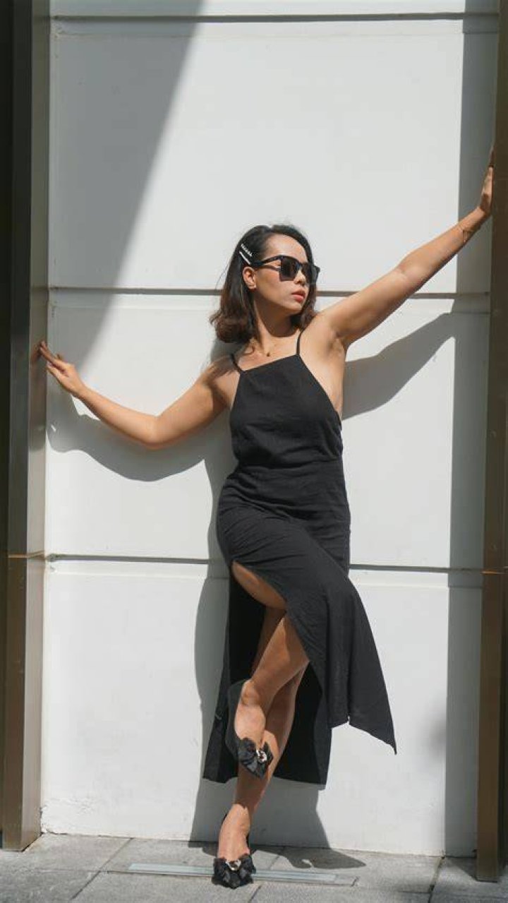 a woman wearing a black suit a woman wearing a black suit