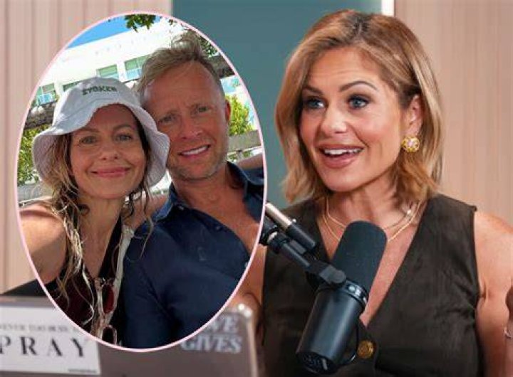 Candace Cameron Bure works out with a weight on a mat with the help of trainer Kira Stokes