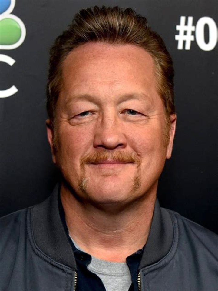 Christian Stolte as Randy "Mouch" McHolland, Joe Minoso as Joe Cruz, Yuri Sardarov as Otis, Eamonn Walker as Wallace Boden and Gary Cole as Chief Grissom stand inside of Firehouse 51