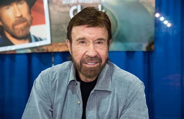 Chuck Norris, turned slightly to the right, gesturing while talking