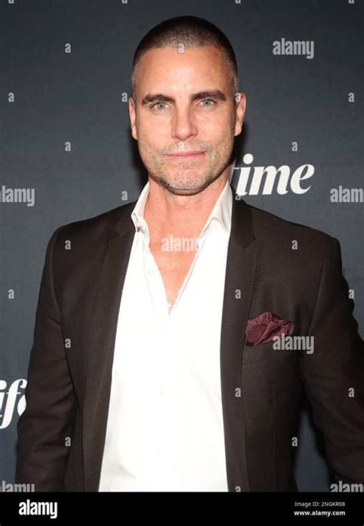 Colin Egglesfield as Randy Rother, looking at Chrishell Stause in 'A Rose for Her Grave' on Lifetime