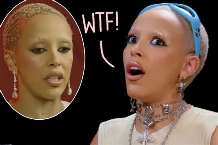 Doja Cat, who was compared to Britney Spears after shaving her head, wearing a black blazer