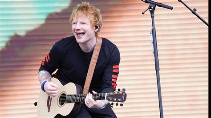 Ed Sheeran smiling during a concert