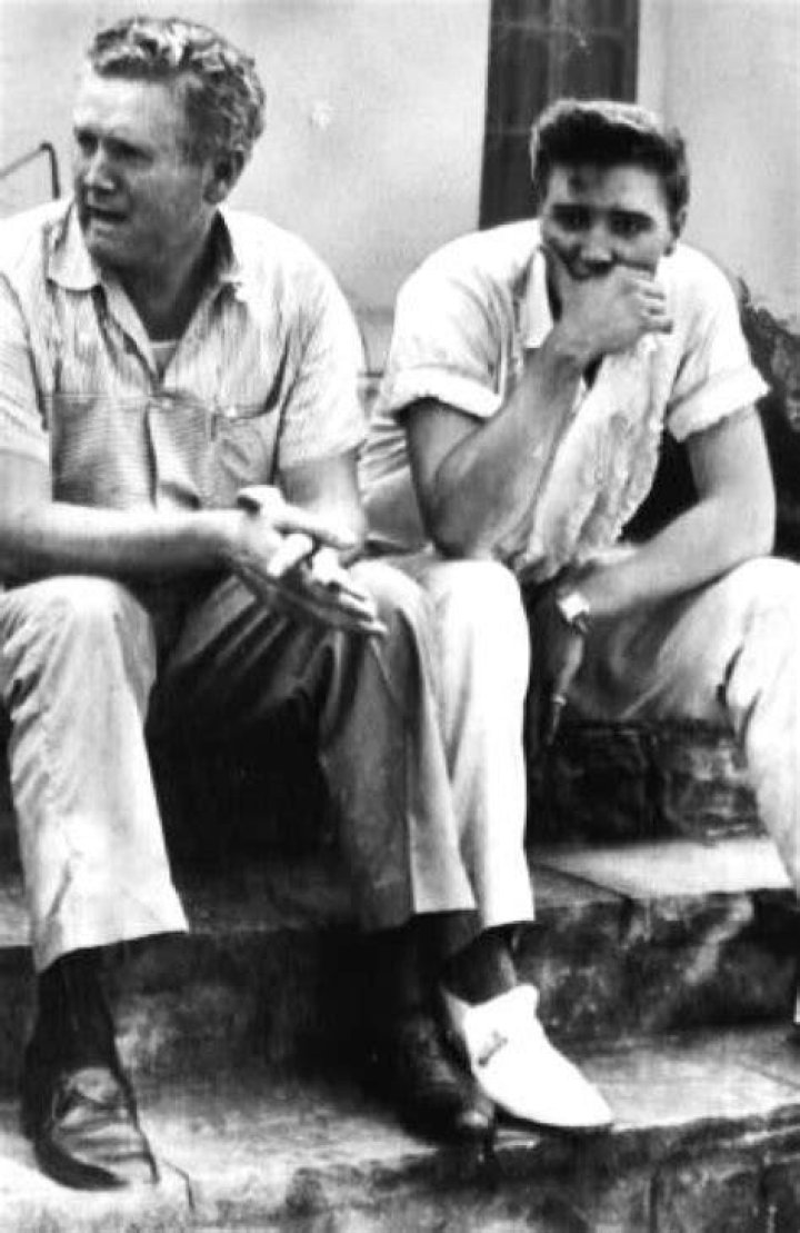 Elvis Presley and his father, Vernon Presley, discuss the illness of Presley's mother outside her hospital room in 1958