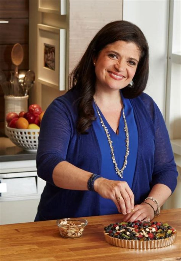 Food Network chef Alex Guarnaschelli prepares a double-decker sandwich, 2016.