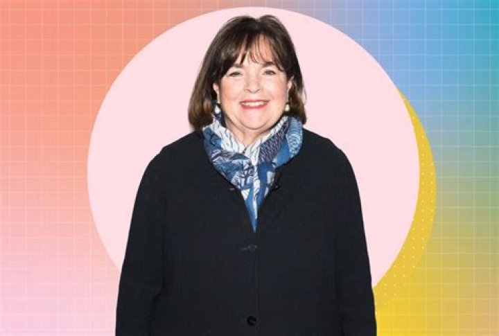 Ina Garten smiling in front of a white background