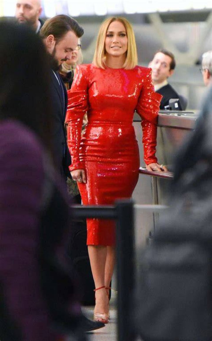 Jennifer Lopez wears a leather top and flowing skirt as she goes up to accept an MTV award.