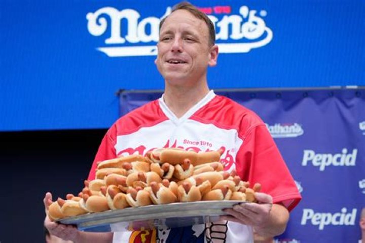 Joey Chestnut at the 2023 Hot Dog Eating Contest. Tim Robinson on the red carpet