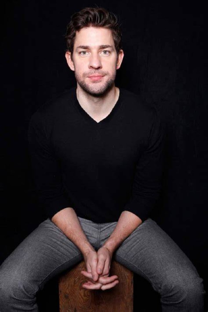 John Krasinski poses for pictures in front of the Amazon Prime Video logo at the premiere of "Jack Ryan"