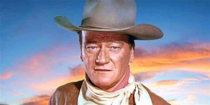 John Wayne, who frequently says 'pilgrim' holding a mug