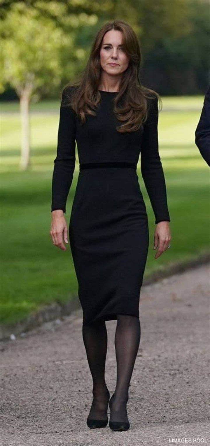 Kate Middleton wears a black hat and veil and looks forlorn during the funeral of Queen Elizabeth III.