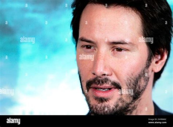 Keanu Reeves poses in Paris in 2016
