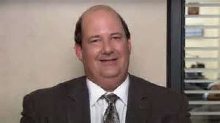 Kevin Malone (Brian Baumgartner) holds part of Michael's Halloween costume in the 'Diwali' episode of 'The Office'