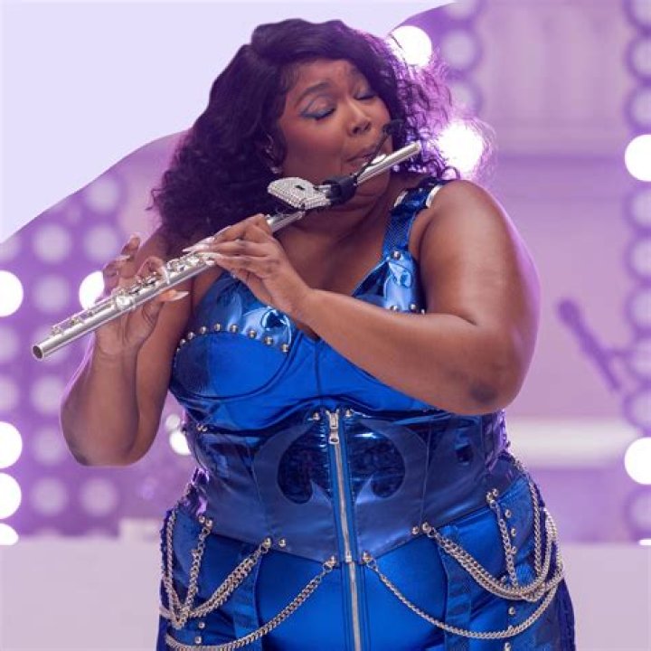 Lizzo holding a flute