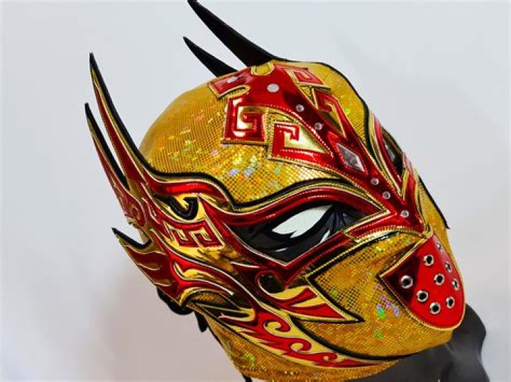 Man with a luchador mask holding his hand over Maddie's mouth in 'Bosch: Legacy' Season 2