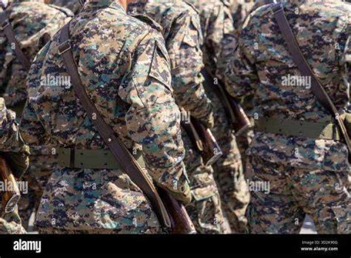 Men carrying rifles attend a "Freedom of Speech Rally Round II" across from the Islamic Community Center of Phoenix, Arizona May 29, 2015. Photo by Nancy Wiechec/Reuters.