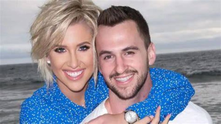 Savannah Palacio and Nick Uhlenhuth sit at a dinner table on 'Perfect Match'.