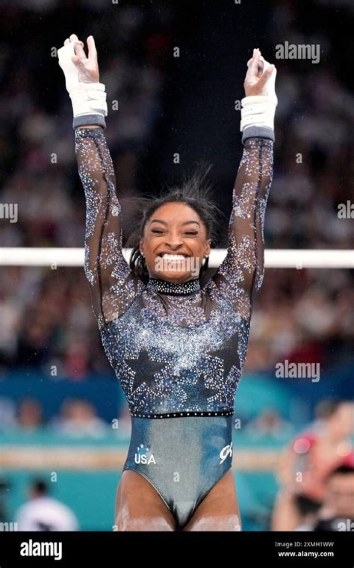 Simone Biles smiles during the qualification round of the women's gymnastics in Tokyo