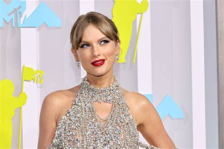 Taylor Swift, who has a higher net worth than Brittany Mahomes, look on from suite during a game with Mahomes' son
