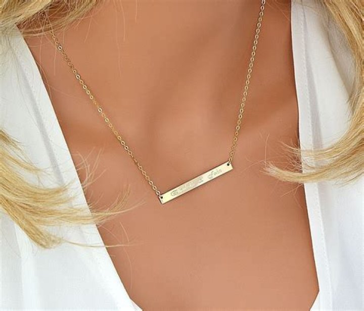 What does a gold bar necklace represent?